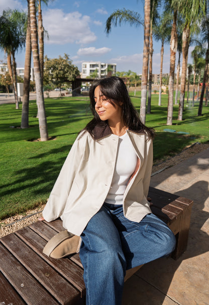 The beige trench coat